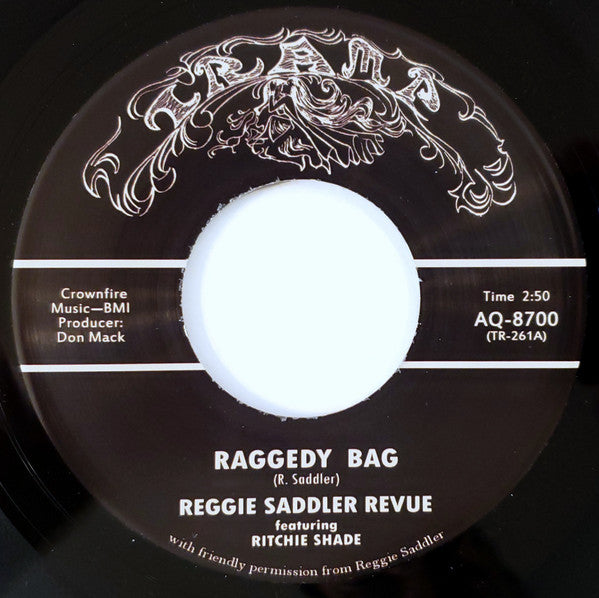 Reggie Saddler Revue : Raggedy Bag (7", Single, RE)