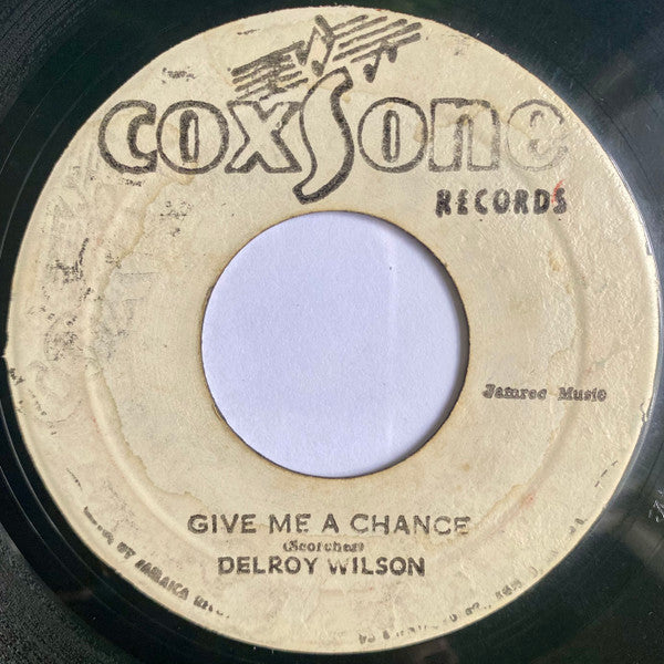 Delroy Wilson : Conquer Me / Give Me A Chance (7")